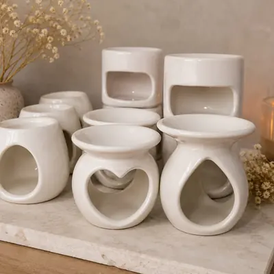 Pebeteros de cerámica blanca esmaltada con calados de corazón, gota, llama y rectángulo